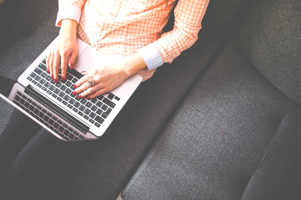 Student starting work on laptop